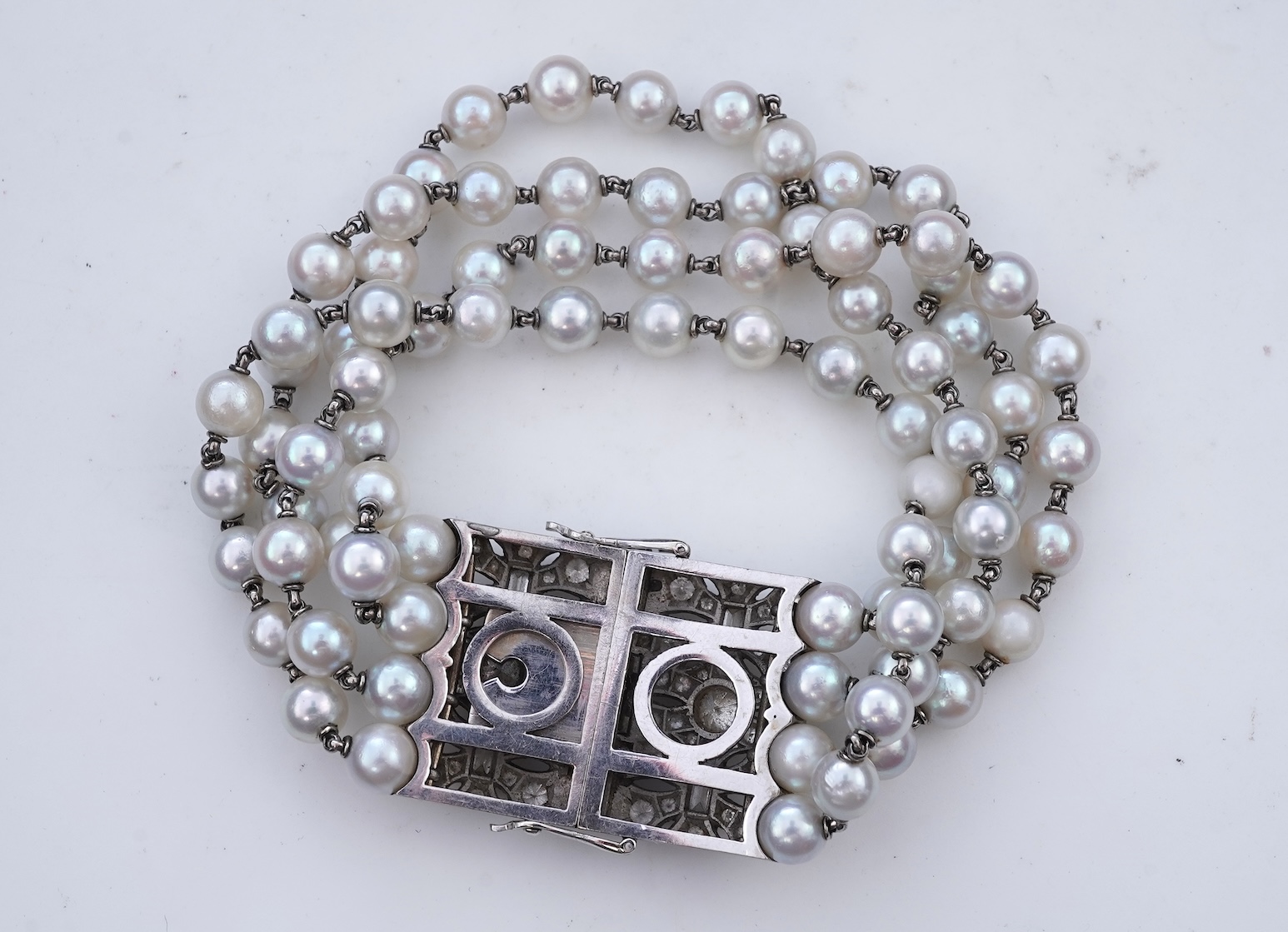 A cultured pearl and diamond bracelet